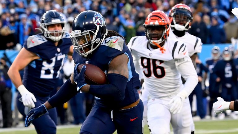 Tennessee Titans running back Derrick Henry (22) runs into the end zone for a touchdown against the Cincinnati Bengals during the first half of an NFL divisional round playoff football game, Saturday, Jan. 22, 2022, in Nashville, Tenn.