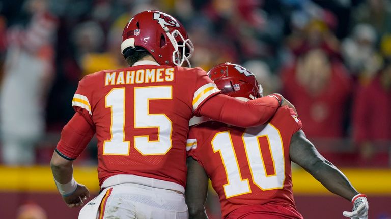Kansas City Chiefs wide receiver Tyreek Hill (10) celebrates with teammate Patrick Mahomes (15) after a 64-yard touchdown reception during the second half of an NFL divisional round playoff football game against the Buffalo Bills, Sunday, Jan. 23, 2022, in Kansas City, Mo.
