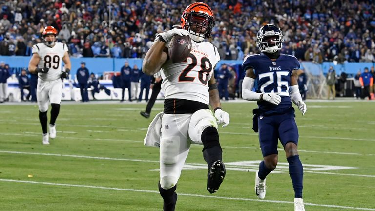 Cincinnati Bengals running back Joe Mixon (28) runs intopo the end zone for a touchdown against the Tennessee Titans during the second half of an NFL divisional round playoff football game, Saturday, Jan. 22, 2022, in Nashville, Tenn. 