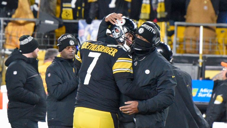 Pittsburgh Steelers head coach Mike Tomlin greets Ben Roethlisberger after Najee Harris scored a touchdown against the Cleveland Browns during the second half an NFL football game, Monday, Jan. 3, 2022, in Pittsburgh. The Steelers won 26-14.