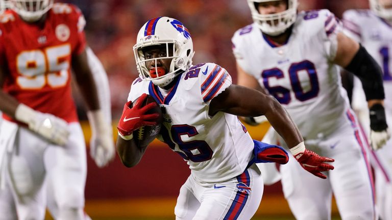 Buffalo Bills running back Devin Singletary (26) carries the ball up field during the first half of an NFL divisional round playoff football game against the Kansas City Chiefs, Sunday, Jan. 23, 2022, in Kansas City, Mo.