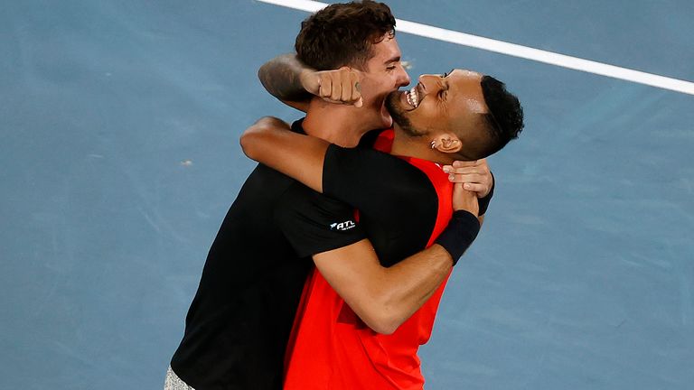Nick Kyrgios, right, and Thanasi Kokkinakis of Australia celebrate their win over compatriots Matthew Ebden and Max Purcell in the men's doubles final at the Australian Open tennis championships in Melbourne, Australia, Saturday, Jan. 29, 2022. (AP Photo/Tertius Pickard)