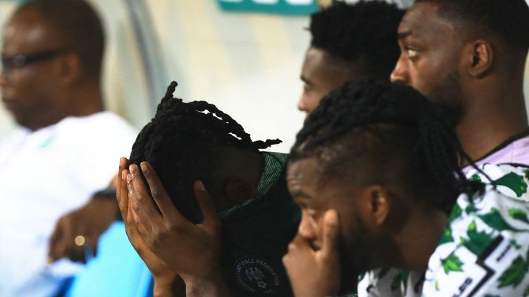 Nigeria&#39;s players react after losing the Africa Cup of Nations (CAN) 2021 round of 16 football match between Nigeria and Tunisia at Stade Roumde Adjia in Garoua on January 23, 2022