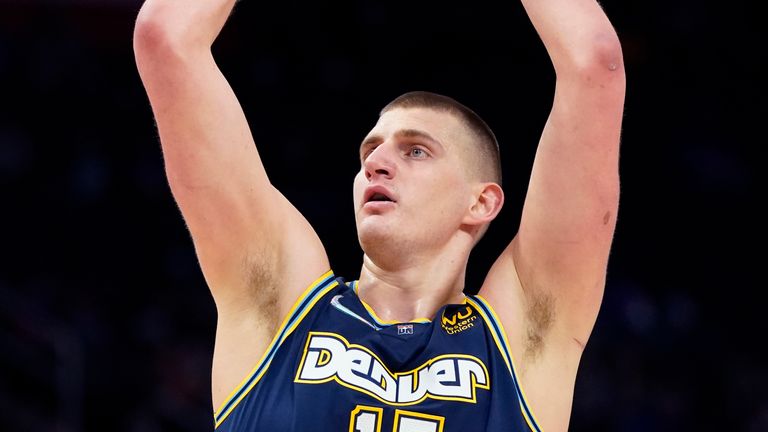 Nikola Jokic takes a shot against the Pistons