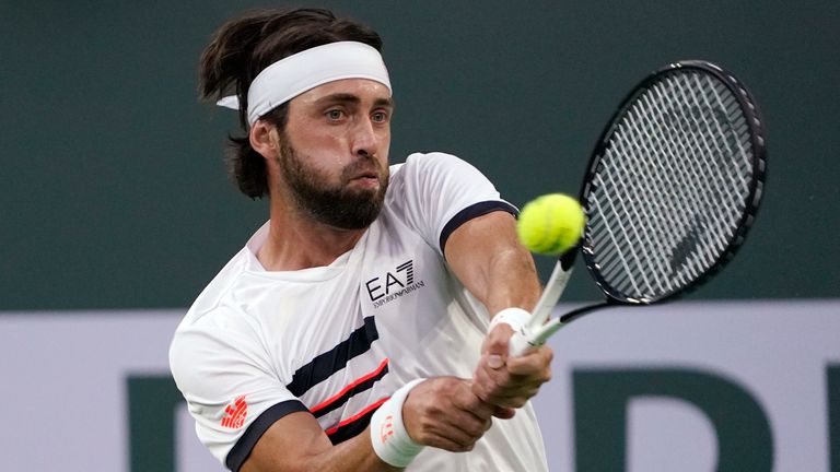 Nikoloz Basilashvili, of Georgia, returns against Cameron Norrie, of Britain, in the singles final at the BNP Paribas Open tennis tournament Sunday, Oct. 17, 2021, in Indian Wells, Calif. (AP Photo/Mark J. Terrill)