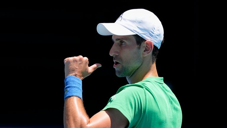 Defending men&#39;s champion Serbia&#39;s Novak Djokovic gestures during a practice session on Margaret Court Arena ahead of the Australian Open tennis championship in Melbourne
