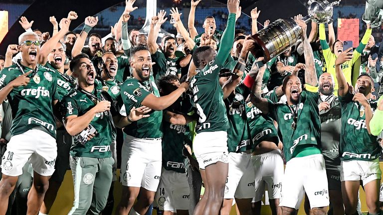 elipe Melo of Palmeiras lifts the Champions Trophy of Copa CONMEBOL Libertadores after the final match of Copa CONMEBOL Libertadores 2021 between Palmeiras and Flamengo at Centenario Stadium on November 27, 2021 in Montevideo, Uruguay.