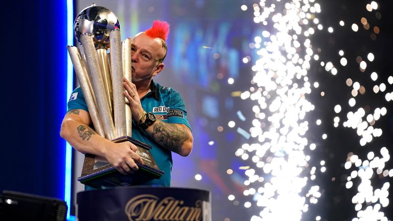 Peter Wright with the Sid Waddell Trophy after victory against Michael Smith during day sixteen of the William Hill World Darts Championship at Alexandra Palace, London. Picture date: Monday January 3, 2022.
