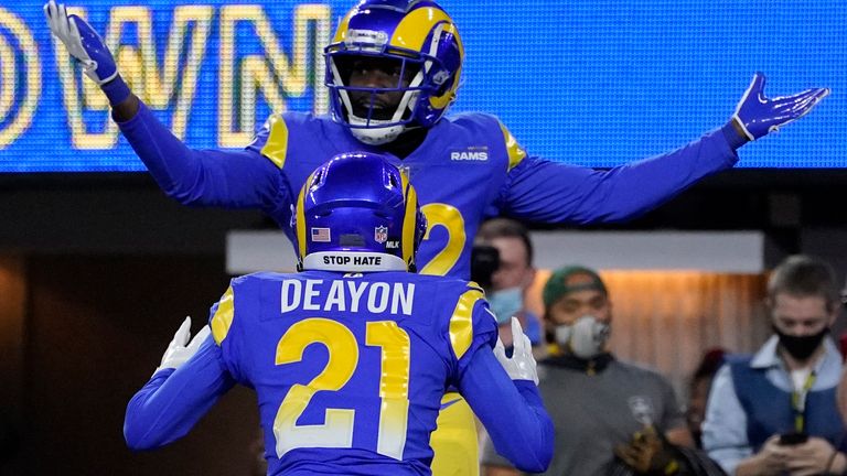 Los Angeles Rams defensive back David Long Jr., top, is congratulated by cornerback Donte&#39; Deayon (21) after returning an interception for a touchdown during the first half of an NFL wild-card playoff football game against the Arizona Cardinals in Inglewood, Calif., Monday, Jan. 17, 2022.