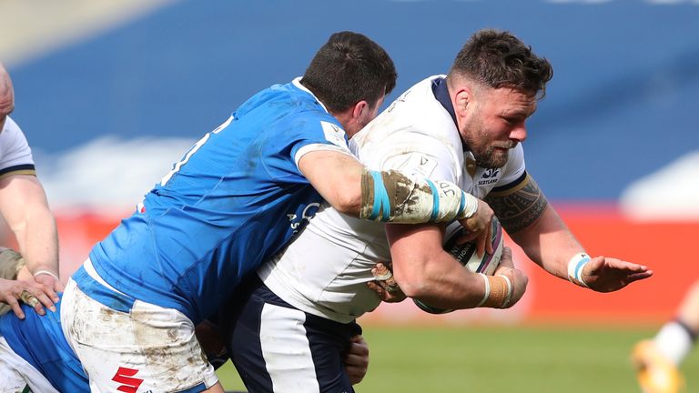Scotland's Rory Sutherland, right, is tackled by Italy's Sebastian Negri during the rugby union international match between Scotland and Italy at the Murrayfield stadium in Edinburgh, Scotland, Saturday, March 20, 2021. (AP Photo/Scott Heppell)