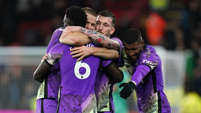 Tottenham mob Sanchez after his late winner