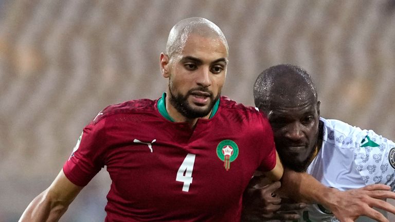 Morocco&#39;s Sofyan Amrabat s challenged by Comoros&#39; El Fardou Ben Nabouhane, during the African Cup of Nations 2022 group C soccer match between Morocco and Comoros.