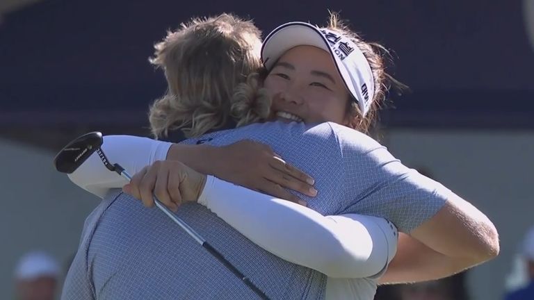 Jed Morgan and Su Oh embrace following their wins in the Australian PGA and WPGA Championships in Brisbane.