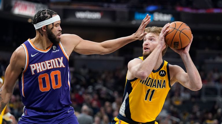 Indiana Pacers&#39; Domantas Sabonis shoots against Phoenix Suns&#39; JaVale McGee during the first half of an NBA basketball game, Friday, Jan. 14, 2022, in Indianapolis. 