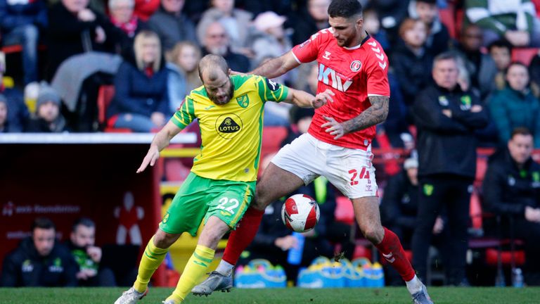 Teemu Pukki and Ryan Inniss challenge for the ball (AP)