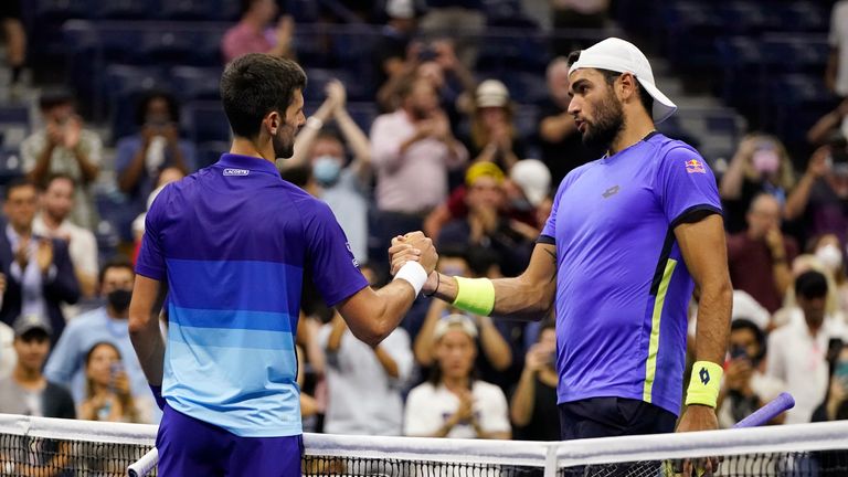 Novak Djokovic, left, of Serbia, shakes hands with Matteo Berrettini, of Italy, after Djokovic&#39;s win during the quarterfinals of the U.S. Open tennis tournament Thursday, Sept. 9, 2021, in New York. (AP Photo/Frank Franklin II)


