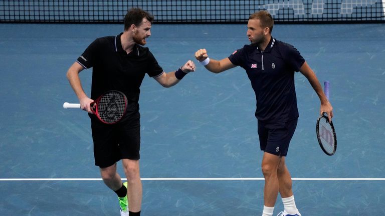 Britain's Daniel Evans, right, and Jamie Murray celebrate winning the first set against Germany's Alexander Zverev and Kevin Krawietz during their doubles match at the ATP Cup tennis tournament in Sydney, Sunday, Jan. 2, 2022.
