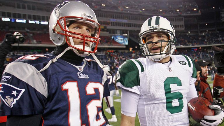 New England Patriots quarterback Tom Brady (12) and New York Jets quarterback Mark Sanchez (6) leave  the field after the Jets beat the Patriots 28-21 in an NFL divisional playoff football game in Foxborough, Mass., Sunday, Jan. 16, 2011. (AP Photo/Stephan Savoia)