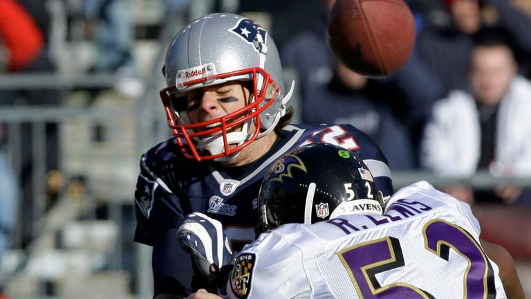 Baltimore Ravens linebacker Ray Lewis (52) hits New England Patriots quarterback Tom Brady (12) just as he releases a pass in the first quarter of an NFL wild-card playoff football game in Foxborough, Mass., Sunday, Jan. 10, 2010. (AP Photo/Charles Krupa)