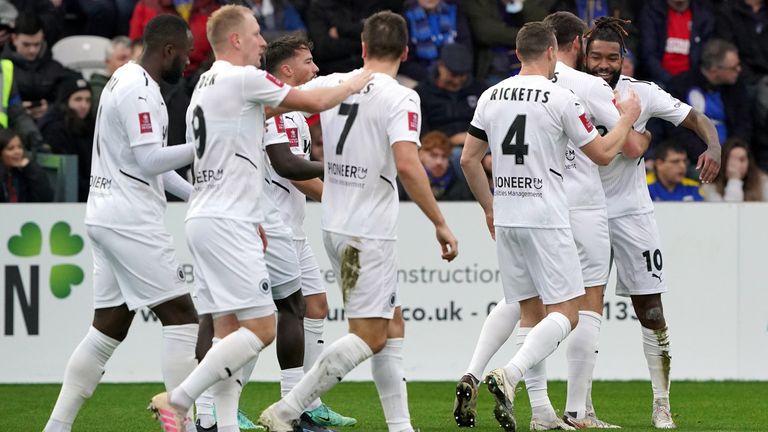 Boreham Wood's Tyrone Marsh (right) celebrates scoring their side's first goal of the game