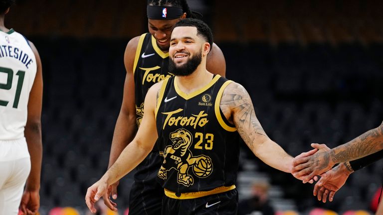 Toronto Raptors guard Fred VanVleet celebrates with teammates after recording his first ever triple-double during second half NBA basketball action against the Utah Jazz
