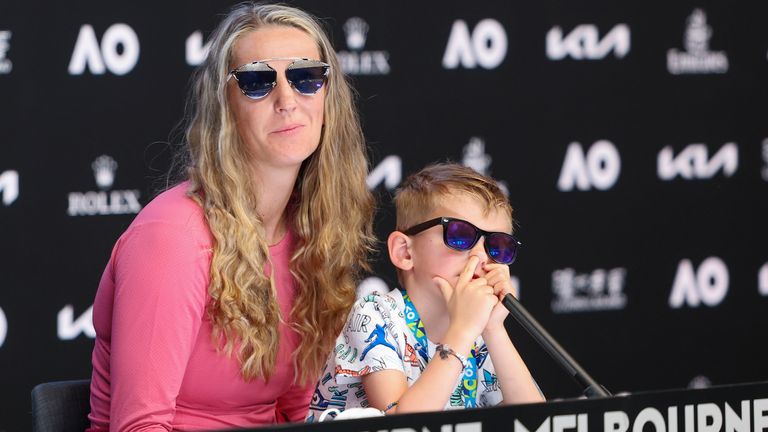 Victoria Azarenka of Belarus sits with her son Leo during a press conference following her third round win over Elina Svitolina of Ukraine at the Australian Open tennis championship in Melbourne, Australia, Friday, Jan. 21, 2022. (David Mariuz/Tennis Australia via AP)