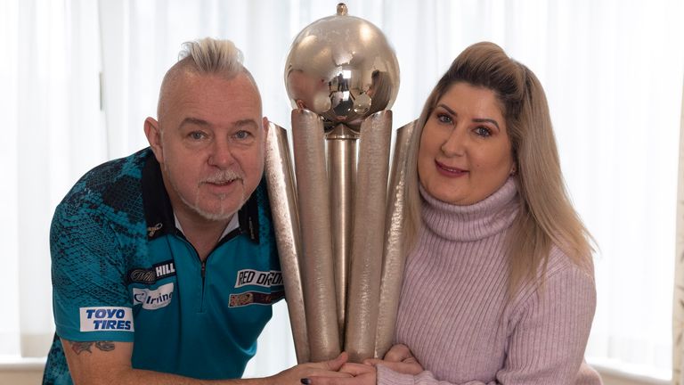 WILLIAM HILL WORLD DARTS CHAMPIONSHIP 2022.GOLDERS GREEN,.LONDON.PIC;LAWRENCE LUSTIG.THE MORNING AFTER THE NIGHT BEFORE.NEWLY CROWNED WORLD CHAMPION PETER WRIGHT AND WIFE JO GET TO GRIPS WITH THE SID WADDELL TROPHY