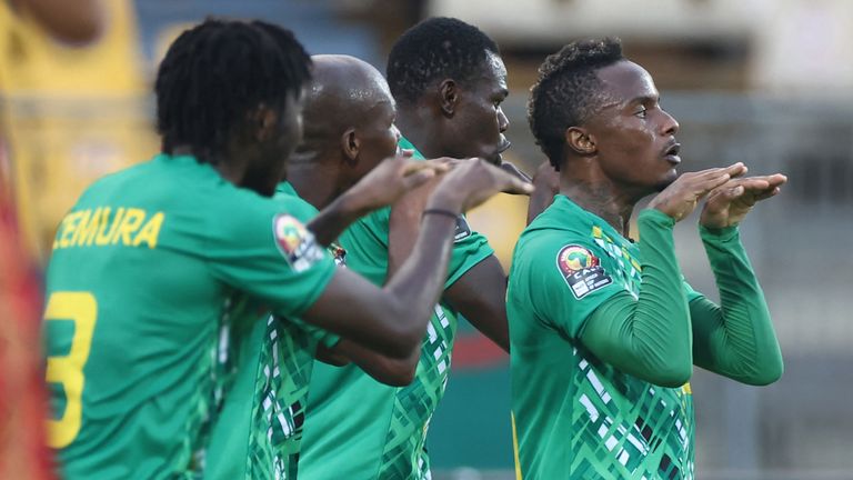 Kudakwashe Mahachi celebrates with team-mates after scoring Zimbabwe's second goal against Guinea