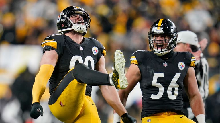 Pittsburgh Steelers outside linebacker T.J. Watt (90) celebrates with outside linebacker Alex Highsmith (56) after sacking Cleveland Browns quarterback Baker Mayfield in the first half of an NFL football game, Monday, Jan. 3, 2022, in Pittsburgh.