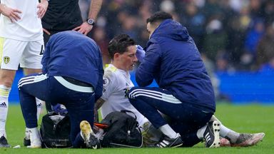 Image of Leeds United's Robin Koch receives medical treatment after suffering a head injury against Manchester United