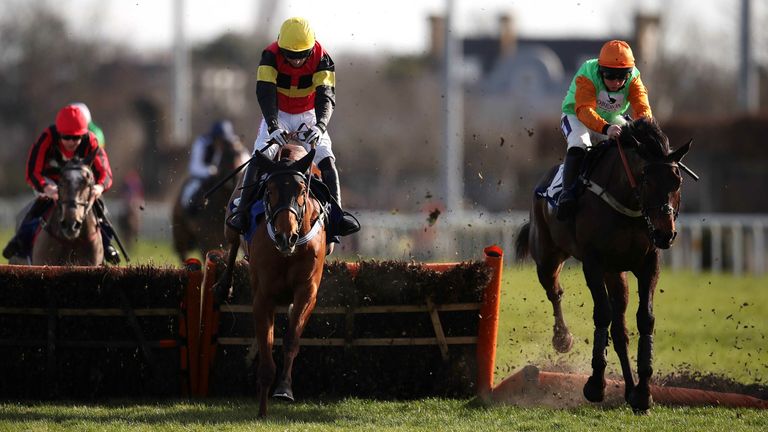 Knight Salute (left) ridden by jockey Paddy Brennan on their way to winning the Coral Adonis Juvenile Hurdle at Kempton Park racecourse. Picture date: Saturday February 26, 2022.