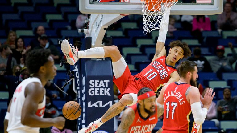 New Orleans Pelicans center Jaxson Hayes (10) dunks against the Toronto Raptors during the first half of an NBA basketball game in New Orleans, Monday, Feb. 14, 2022.