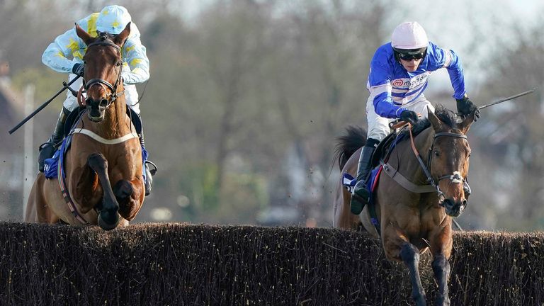 SUNBURY, ENGLAND - FEBRUARY 26: Harry Cobden riding Pic D&#39;Orhy (R) clear the last to win The Coral Pendil Novices&#39; Chase at Kempton Park Racecourse on February 26, 2022 in Sunbury, England. (Photo by Alan Crowhurst/Getty Images)