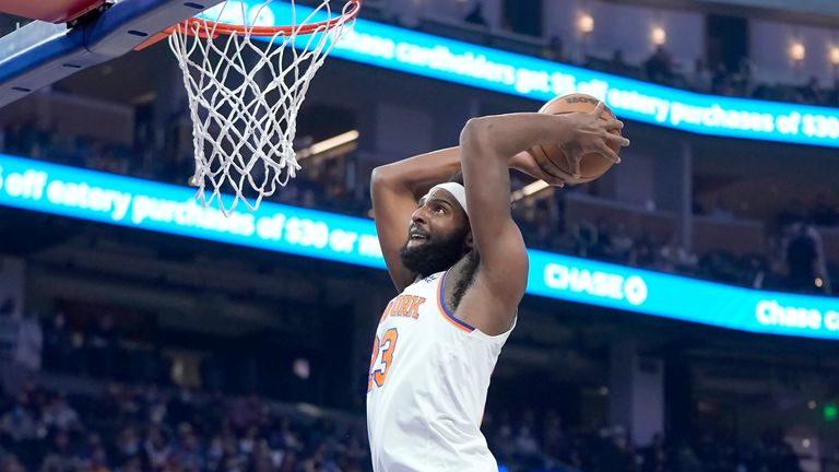 New York Knicks center Mitchell Robinson (23) dunks against the Golden State Warriors during the first half
