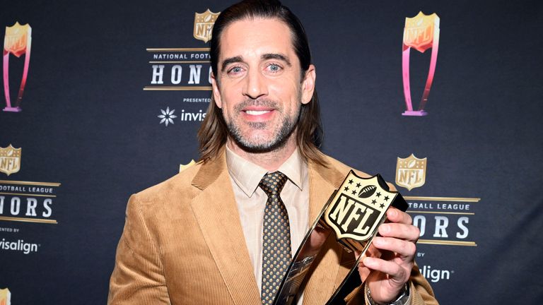 Green Bay Packers Aaron Rodgers poses with the MVP trophy after winning 2021 award (AP)