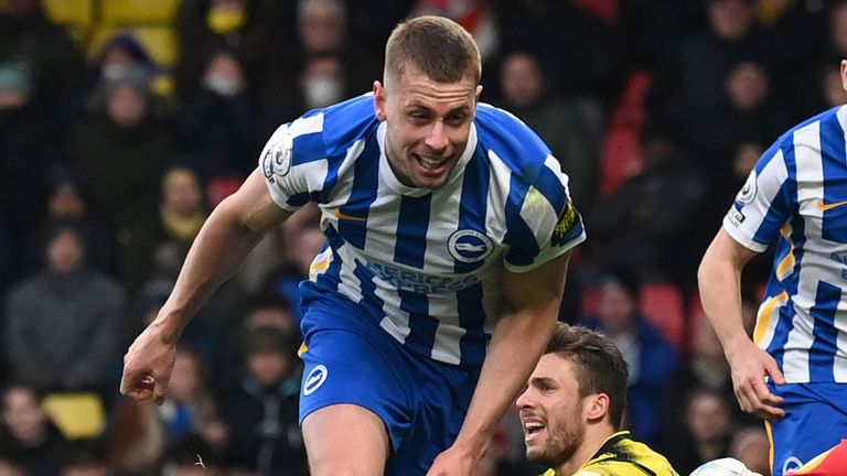 Adam Webster celebrates after doubling Brighton's lead at Watford