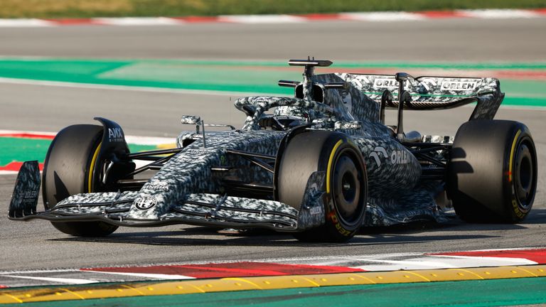 Alfa Romeo reveal a special camouflage livery for testing on the opening day of pre-season in Barcelona (AP)