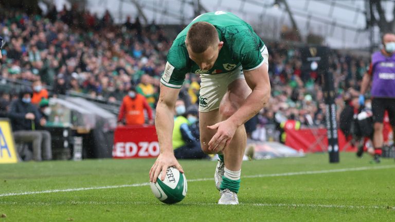 Ireland's Andrew Conway puts the ball down as he scores his second try