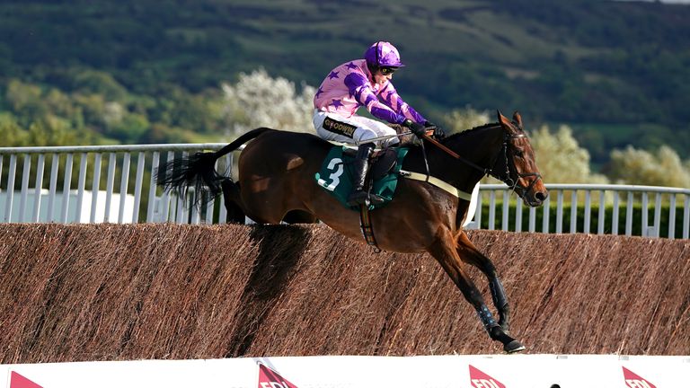 Annual Invictus jumps to victory at Cheltenham under jockey Tom Cannon