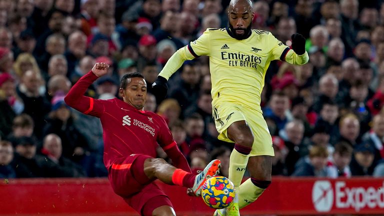 Liverpool's Thiago and Arsenal's Alexandre Lacazette battle for the ball