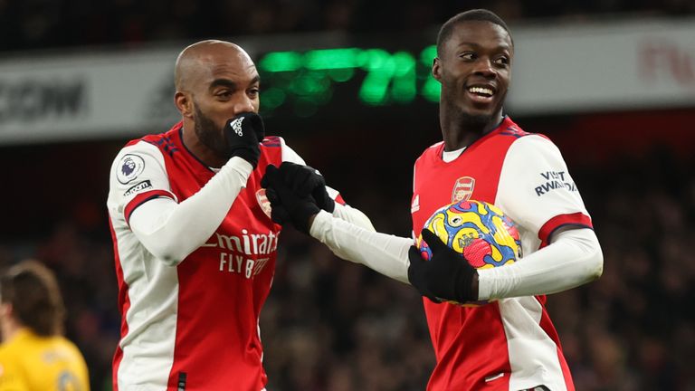 Arsenal's Nicolas Pepe (right) celebrates with Alexandre Lacazette after scoring against Wolves