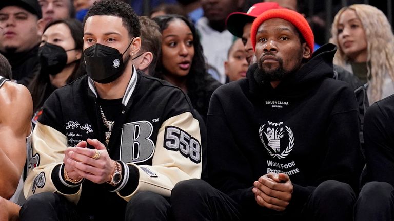 Ben Simmons and Kevin Durant watch the Brooklyn Nets from the sideline