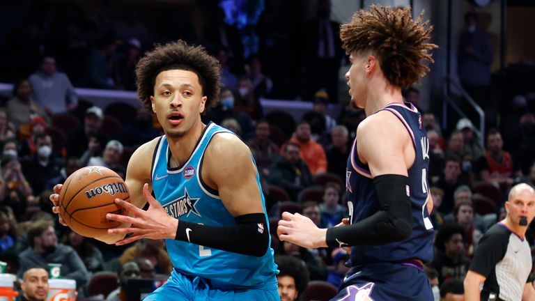 Team Barry's Cade Cunningham, of the Detroit Pistons, drives against Team Payton's LaMelo Ball, of the Charlotte Hornets, during a semifinal of the NBA basketball Rising Stars event