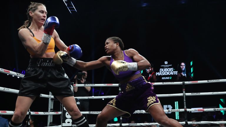 Caroline Dubois backs her opponent up towards the ropes 