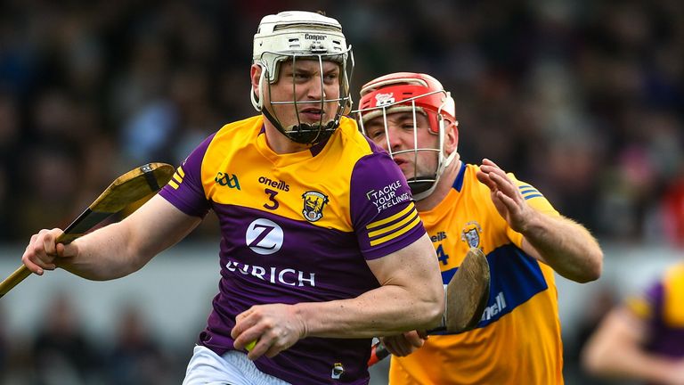 Liam Ryan of Wexford in action against Domhnall McMahon of Clare
