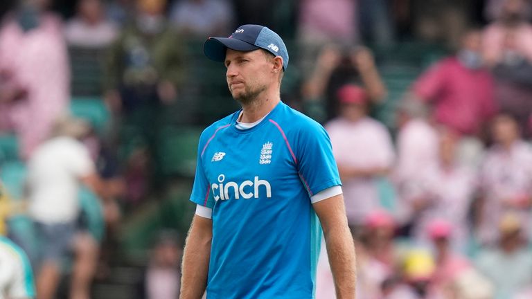 England&#39;s Joe Root watches ground crew prepare the pitch before the start of the third day of their Ashes cricket test match in Sydney, Friday, Jan. 7, 2022. 