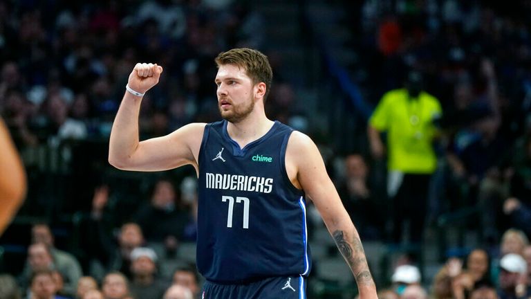 Dallas Mavericks guard Luka Doncic (77) reacts after his team scored against the Los Angeles Clippers during the fourth quarter of an NBA basketball game in Dallas, Thursday, Feb. 10, 2022. (AP Photo/LM Otero)