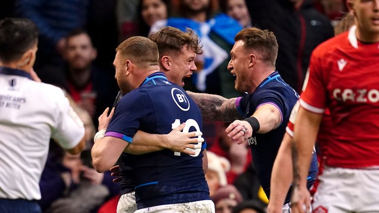 Scotland's Darcy Graham celebrates scoring the opening try of the game