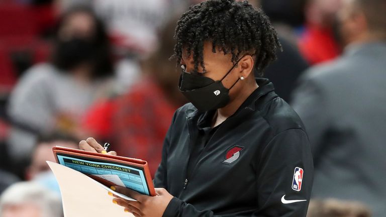 Portland Trail Blazers assistant coach Edniesha Curry takes notes during a timeout against the New York Knicks in February 2022
