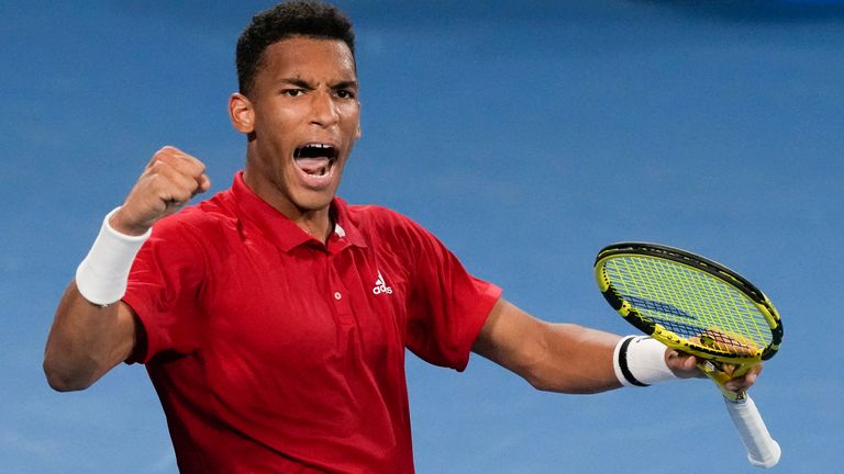 Canada's Felix Auger-Aliassime celebrates after defeating Britain's Cameron Norrie in their match at the ATP Cup tennis tournament in Sydney, Australia, Tuesday, Jan. 4, 2022. (AP Photo/Mark Baker)